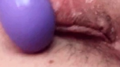 Play with my pussy with my purple vibrator