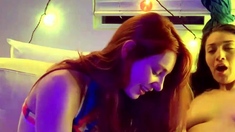 Redhead and brunette lesbians make out