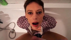 Short hair mature takes facial in the bathtub